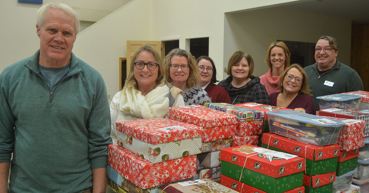 CRCF Board President Skip Wilday (far left) meets with the Gift Tree committee at the new gift distribution location at Creekside Chapel. Pictured (from l-r) are Katie Wilkinson (board member), Danielle Kielar (board member), Megan Moretz (Gift Tree committee member), Julie Hall (Executive Director) Erica Dreher (committee), Ann Marie Sitter Tompkins (committee) and Dann Deckman-Hadden (committee).